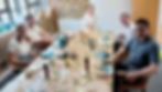 team members painting at the table