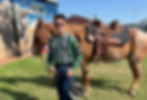Boy standing with a horse at Freedom Gates Boys Ranch