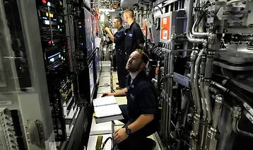 Sailors assigned to Pre-Commissioning Unit Indiana (SSN 789) perform a systems status check and simulate torpedo launch procedures on the weapons launch console while underway. Indiana is the 16th Virginia-class fast attack submarine and is scheduled to be commissioned Sept. 29, 2018. (U.S. Navy photo by Chief Mass Communication Specialst Darryl Wood/Released)
