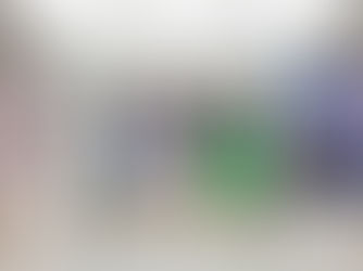 A museum exhibit entrance labeled "WHITE OUT" with steps leading up. Flanked by large images of blurred skaters on the left and climbers on a snowy peak on the right.