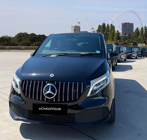 Black Mercedes V Class Fleet with Wembley in background