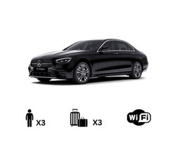 Mercedes E-Class executive chauffeur car for business airport transfers.
