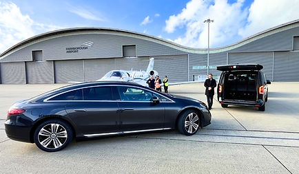 Chauffeur-driven Mercedes S-Class at Heathrow Airport terminal for airport transfer service in London