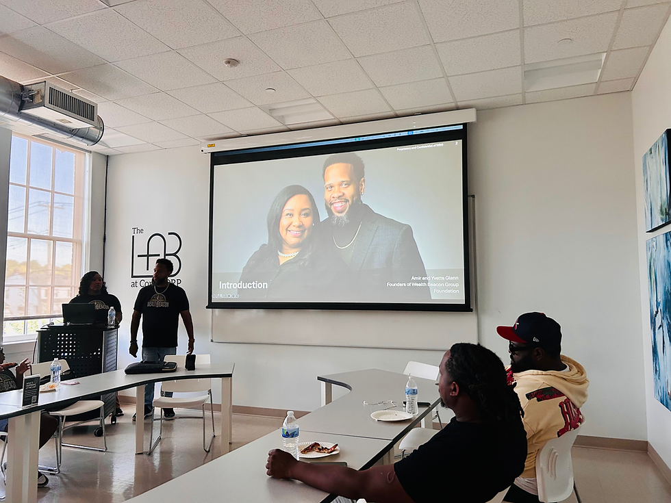 The audience listens, as Amir and Yvette talk about Wealth Beacon Group Foundation work.