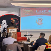 Speaker giving a presentation on market trends at Online Casino Summit Italia, iGaming and sports betting event organised by Eventus International. 