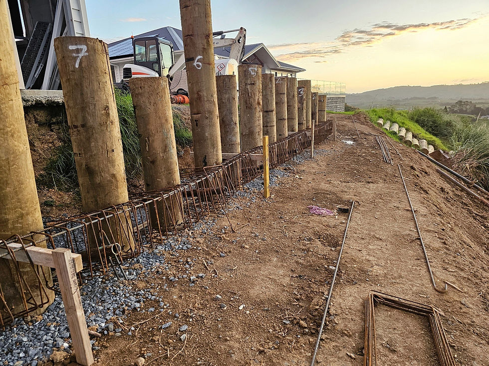Timber poles and reinforcing for a large retaining wall slip repair