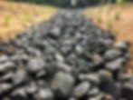 Rock-lined stormwater channel constructed during slip remediation works at Hillsborough Primary School, Auckland