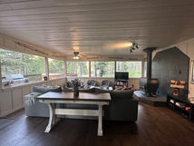 Cozy Living Room with table, plant, couch and television