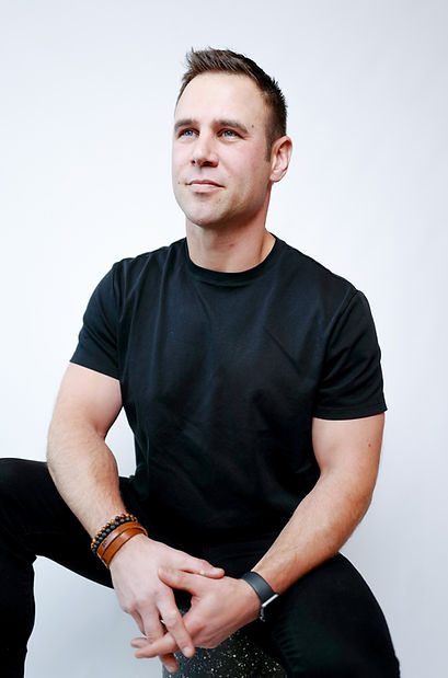 Dustin Serviss seated in a black shirt