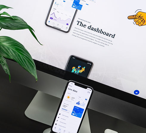 space gray iPhone X on stand near silver iMac and Apple Magic Keyboard_edited_edited.jpg