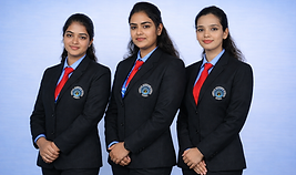 Three young women in black blazers and red ties