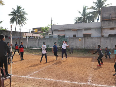 Volleyball game in progress at an event