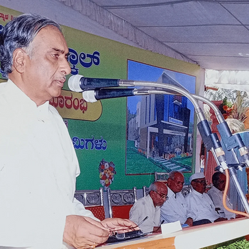 Man speaking at a podium at an event