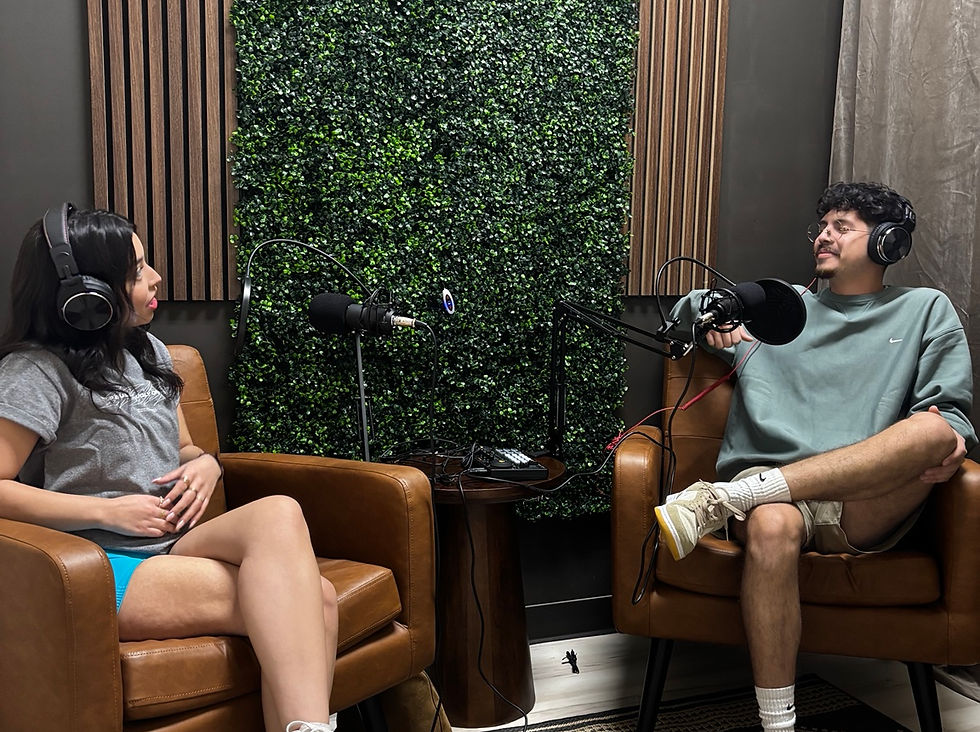 Two people recording in the Brewed Up Echo Yard podcast studio
