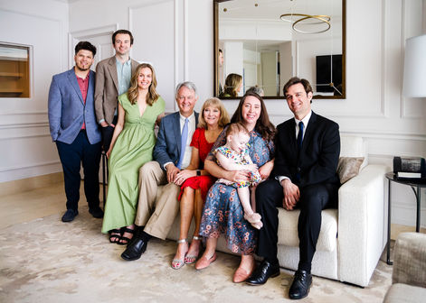 Large multigenerational family arranged together for an indoor group portrait in Miami.