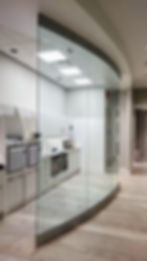 Glass curved wall in office setting