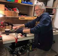 Man sharpening skis