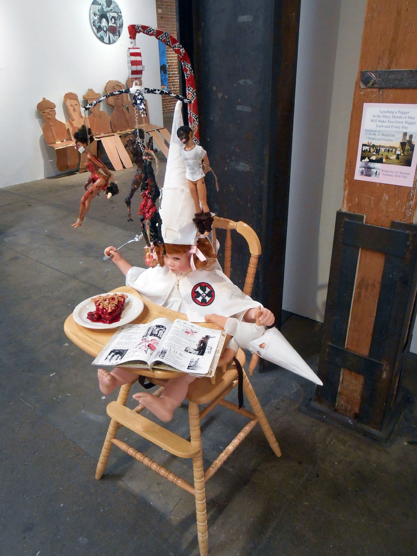 Lili Bernard. American As Cherry Pie, 2014. As American as Cherry Pie, 2014. Baby doll parts, Barbies, highchair, baby mobile, nails, cotton fabric, rope, chain, scissors, digital photos, children’s book, acrylic paint, 60 x 40 x 30 inches