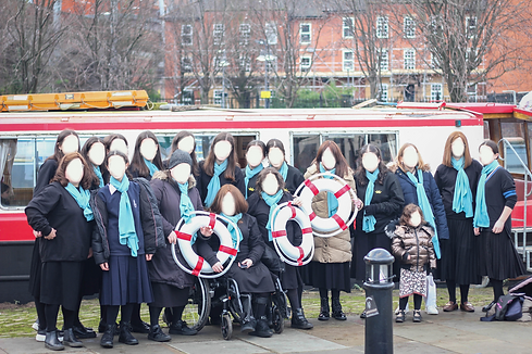 Women in front of a barge