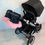 Thumbnail: Extra Fluffy Baby Pink Single Pram Handmuffs on Black Fabric