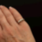 Vintage diamond ring shown worn on the hand.