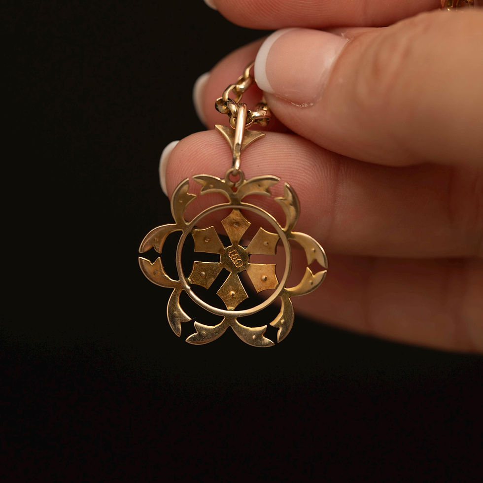 Close-up of the antique Edwardian seed pearl pendant showing the intricate floral openwork.