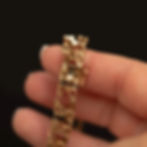Close-up of the openwork links on the vintage 14k gold bracelet.