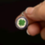 Vintage 800 silver enamel four leaf clover pendant with green shamrock and blue border.