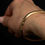 Thumbnail: Vintage 14k Yellow Gold Hollow Bangle with Safety Clasp