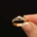 Vintage 14k gold diamond solitaire ring with channel-set diamond shoulders