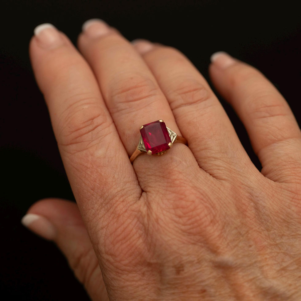 Vintage ruby ring shown worn on hand for scale