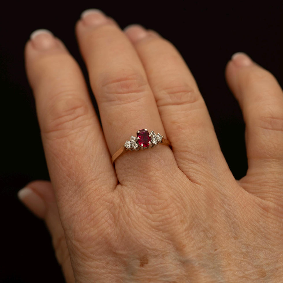 Ruby engagement style ring worn on hand