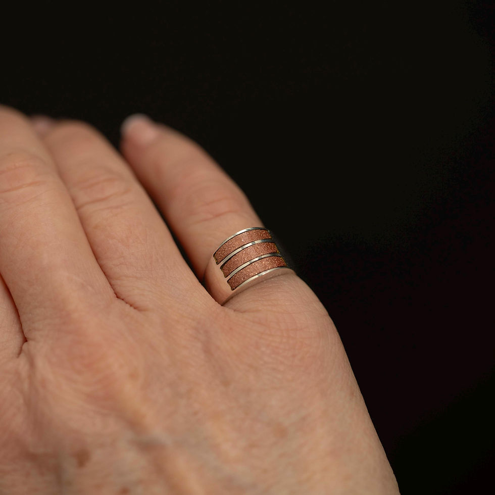 Goldstone inlay statement ring worn on hand for scale