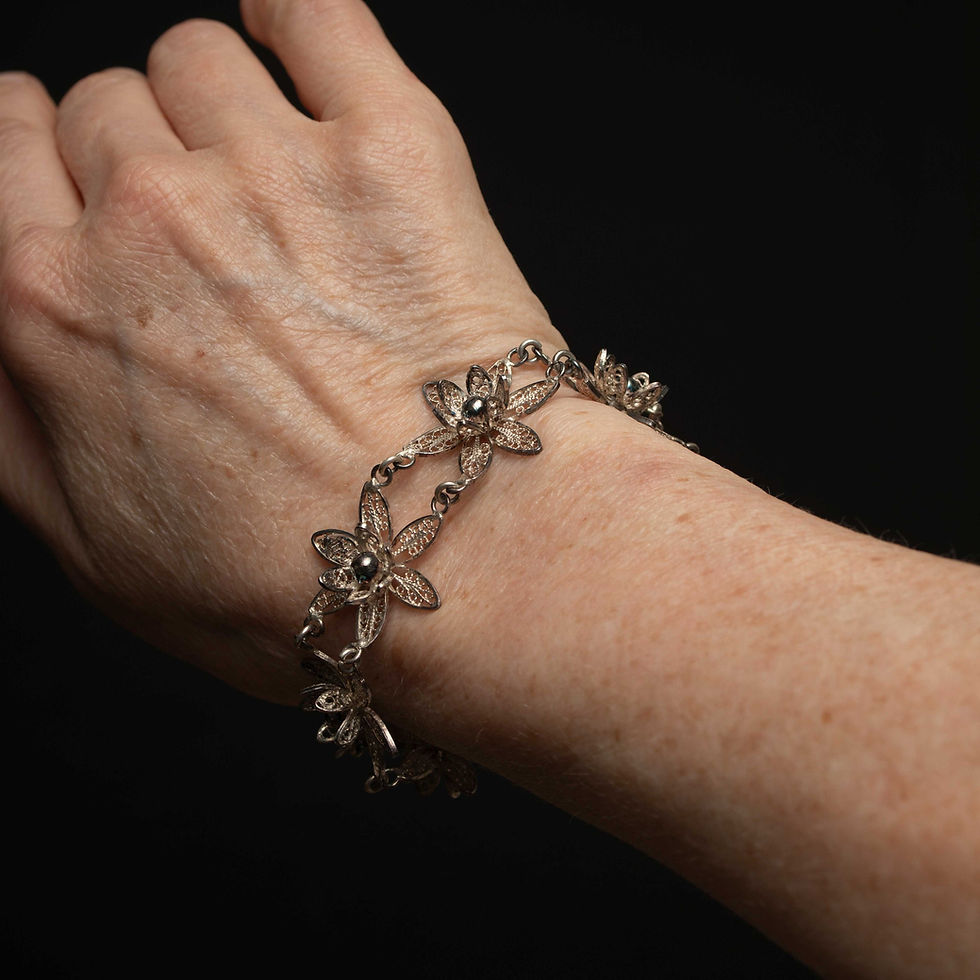 Thumbnail: Silver Flower Filigree Bracelet with Centre Black Pearl Like Gem
