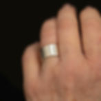 Vintage sterling silver cigar band ring worn on hand showing wide polished band