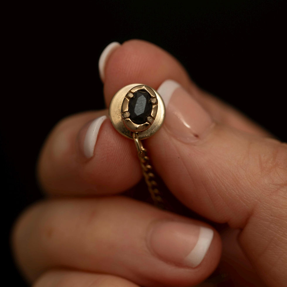 Front view of black Alaskan diamond style tie tack