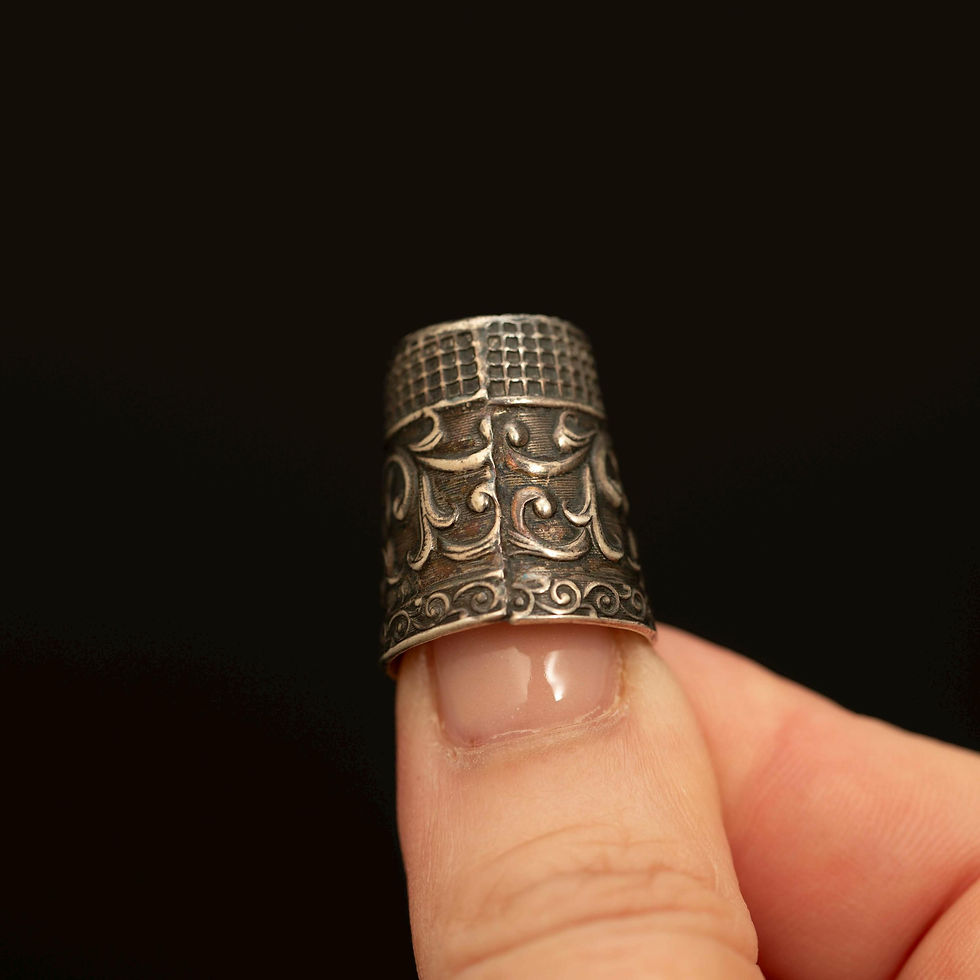 Thumbnail: Vintage sterling silver owl thimble shown worn on finger