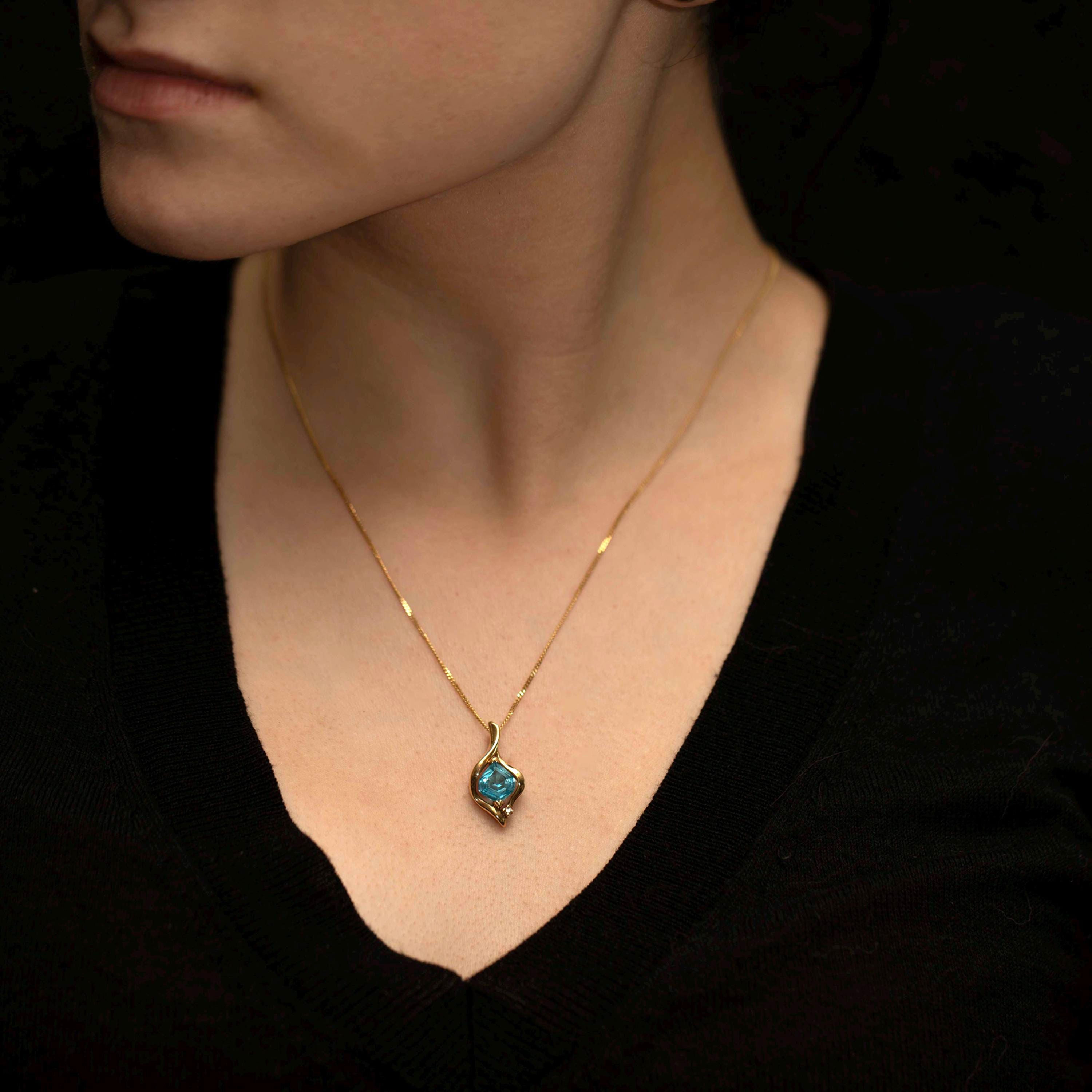 14K Gold Blue Topaz Teardrop Pendant with Diamond Accent