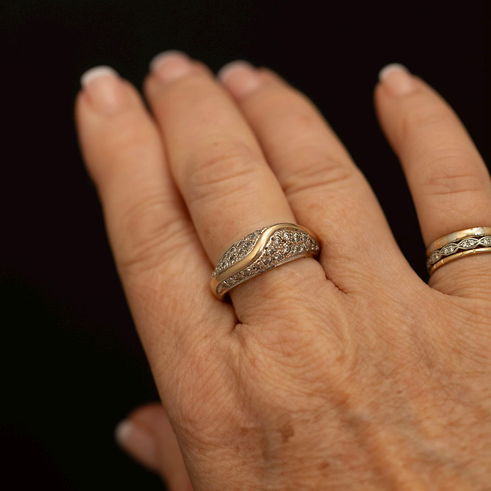 Vintage 9ct gold cubic zirconia ring shown worn on the hand.