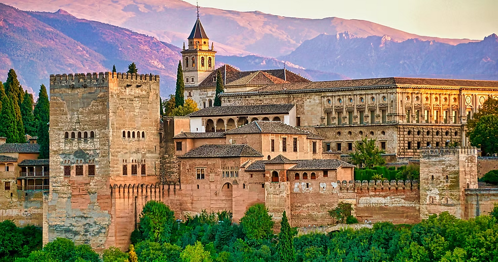 Historic castle with towers and arches amidst lush greenery, set against majestic purple mountains at sunset, exuding a serene ambiance.