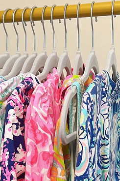 Lily Pulitzer dresses on hangers in closet.jpg