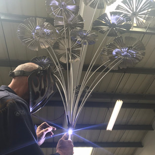 Brian attaching the fan palms to the stems
