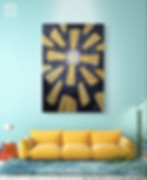 A black and white swirly painting that goes into a sun that is covered up by yellow bolts. It is pictured above a yellow couch in front of a blue wall. There is a orange nightstand and a lamp. The floor is white.