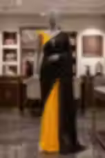 Elegant Black and Yellow Polka Dot Georgette Saree with Designer Ruffle Blouse