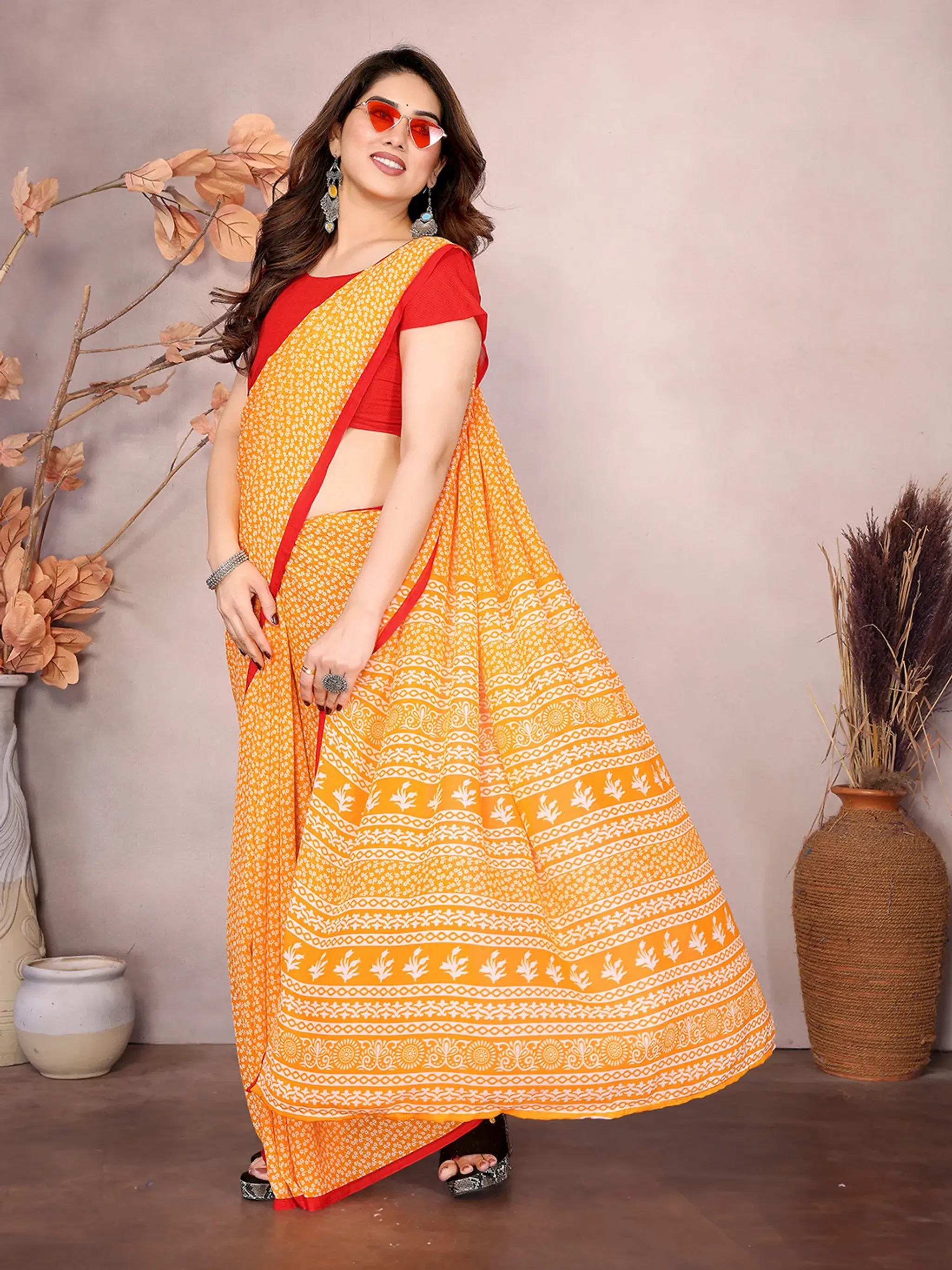 Elegant Yellow Printed Georgette Saree with Red Border and Matching Blouse