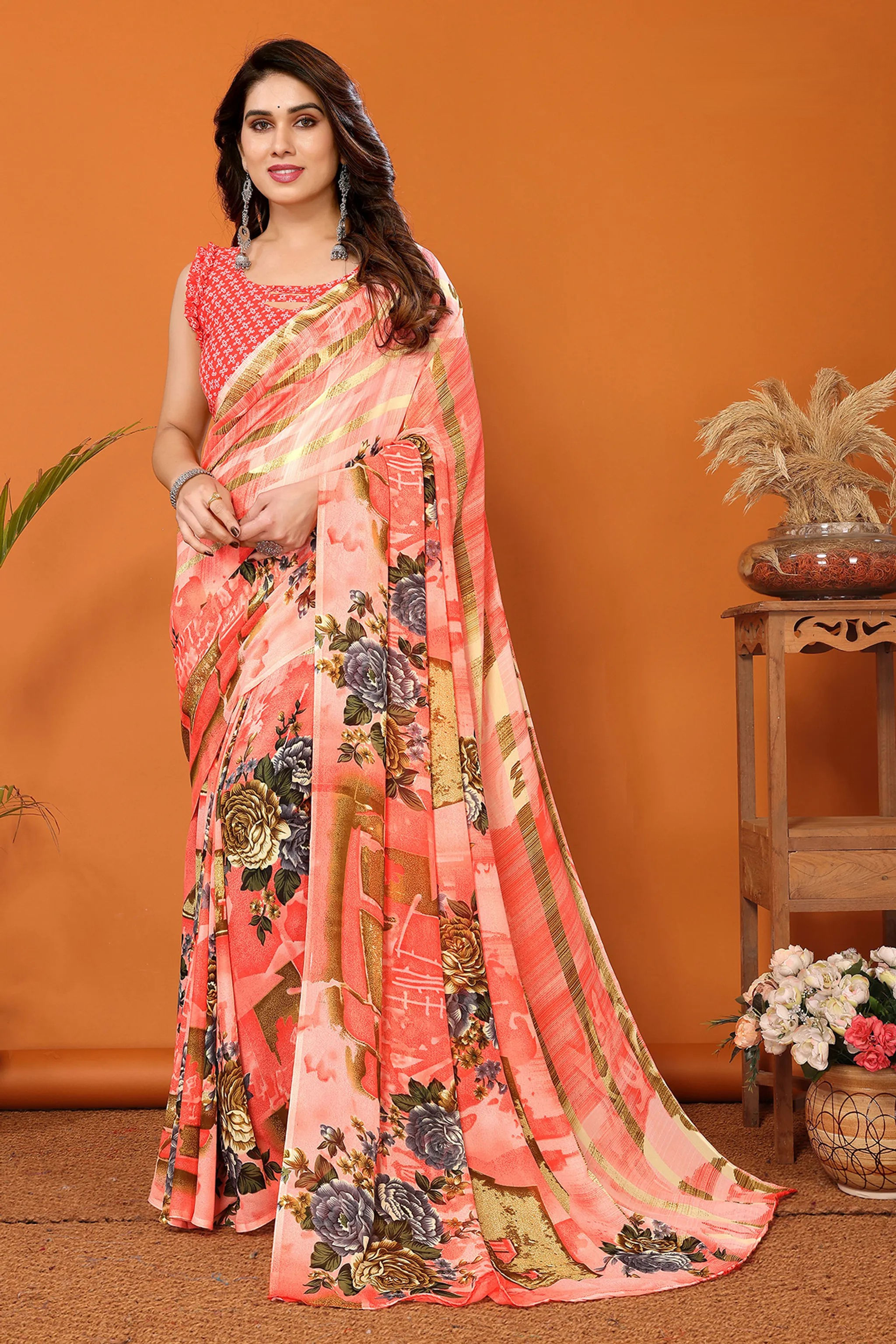 Elegant Peach Floral Printed Georgette Saree with Gold Zari Striped Border