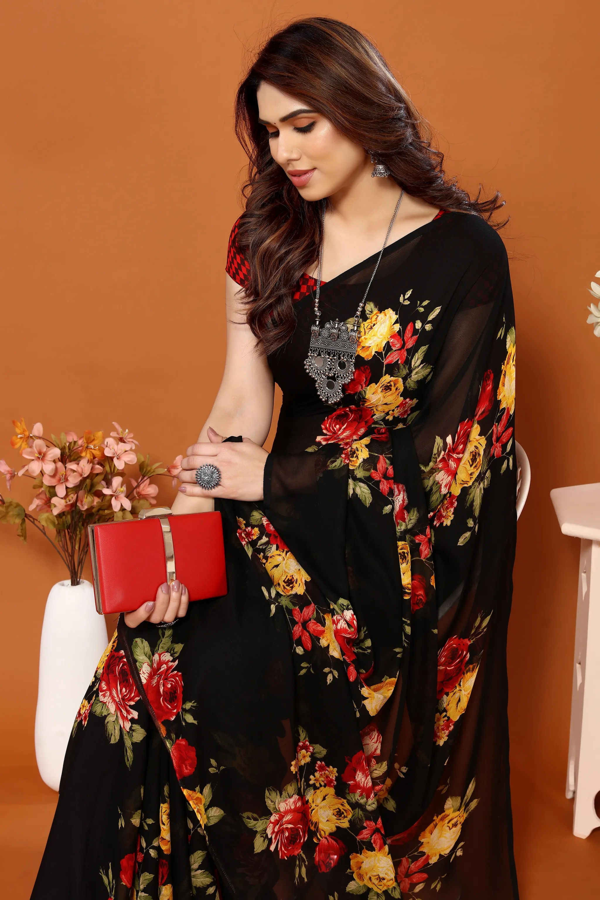 Elegant Black Georgette Floral Print Saree with Red Checkered Blouse