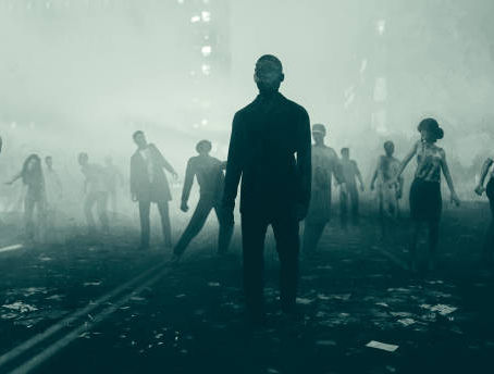 Silhouetted zombies walk through a foggy, debris-strewn street at night, creating an eerie, apocalyptic atmosphere.
