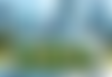 Three green aliens in a UFO smile in a park. Fairies hover nearby. Skyscrapers in the background under a bright blue sky.