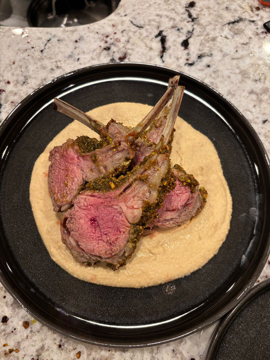 Beautiful medium rare pistachio crusted lamb rack, sat on top of a garlic hummus. Prepared by Crewneck Chef in Raleigh, NC for a couples private dinner.